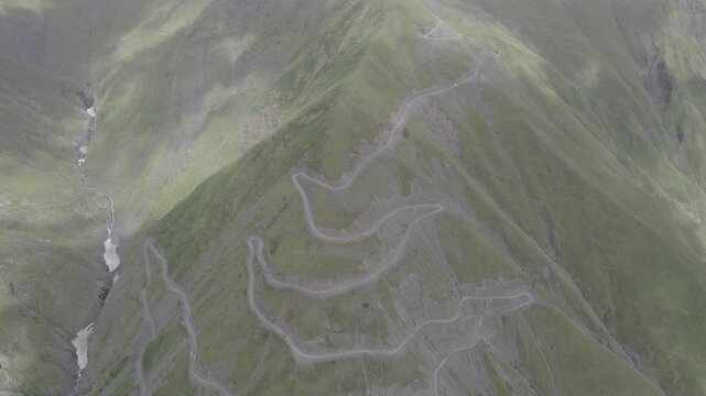 Aerial view of a winding mountain road crossing Abano Pass in Tusheti, Georgia