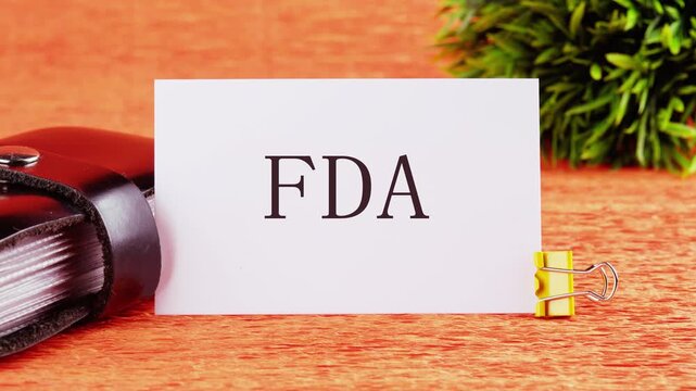 Animation of the FDA text. The appearance of the FDA symbol on the business card, The concept of modern medicine and medical biotechnology. Animated Video.