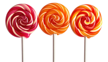 Three swirl lollipops in red, orange, and yellow, stand against a dark backdrop
