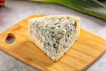 Blue cheese piece over board
