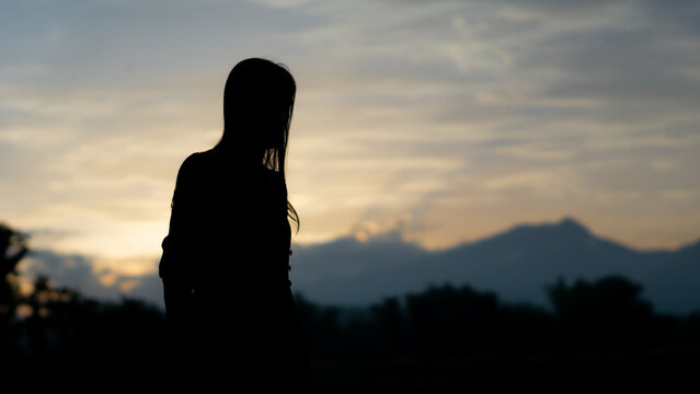 Silhouette of an Asian woman in the afternoon. Introverted woman. World Introvert Day.