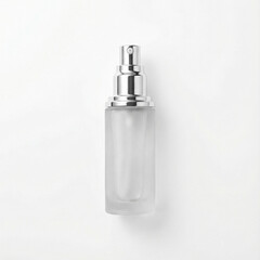 Transparent cosmetic spray bottle with silver cap on white background  