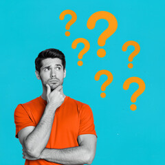 Portrait of a man thinking with question marks on a blue background