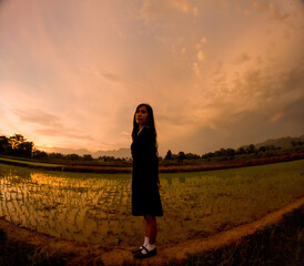 Fototapeta premium Silhouette of an Asian woman in the afternoon. Introverted woman. World Introvert Day.