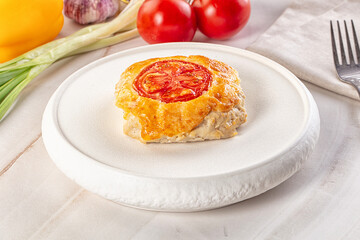 Chicken chop cutlet with cheese and tomato