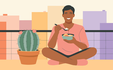 Obraz premium A man enjoying a meal on a rooftop surrounded by plants and cityscape