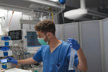 Medical professional analyzing patient data in intensive care unit