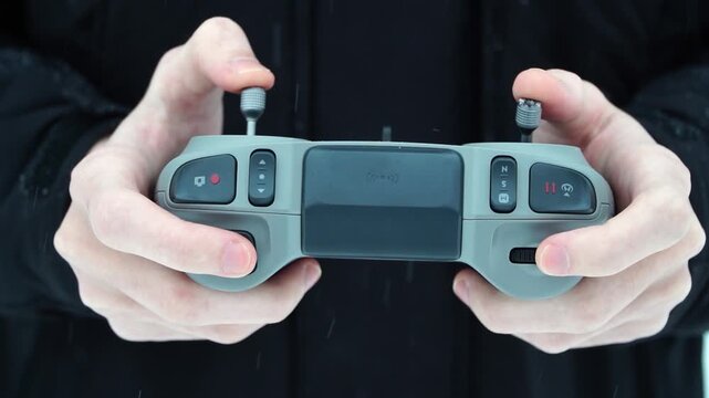 hand holding fpv drone controller