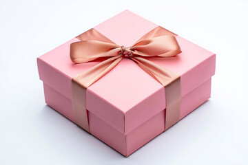 Fototapeta premium Elegant pink gift box tied with a shimmering rose gold satin ribbon sits isolated on white background