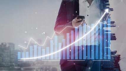 A businessman in a suit is using a smartphone, surrounded by digital financial graphs and growth indicators, representing modern finance and technology in an urban environment. Copula