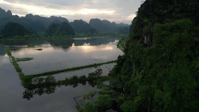 Asia, Ninh B&igrave;nh and Tam Coc  in the Red River Delta region of Vietnam -  limestone karst formations emerge from rice paddies and rivers "Halong Bay on Earth" -  countryside flooded by typhoon