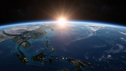 Fototapeta premium Sunrise over Earth's horizon, illuminating continents and oceans from space