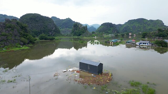 Asia, Ninh B&igrave;nh and Tam Coc  in the Red River Delta region of Vietnam -  limestone karst formations emerge from rice paddies and rivers "Halong Bay on Earth" -  countryside flooded by typhoon