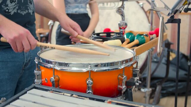 Percussion Warmup Scene, Intimate Depiction Of Musician Adjusting Grip During Lively Practice In Studio. Media