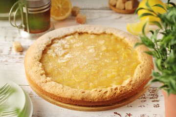 A tart with lemon marmalade served on the table
