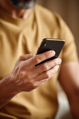 Close-Up of Hand Using Smartphone with Modern Urban Lifestyle Vibe
