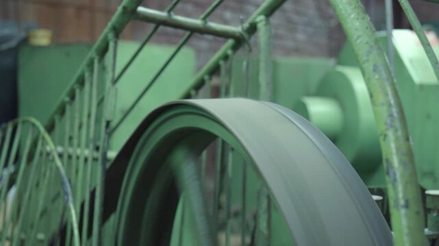 Fast Rotating Flywheel Transmitting Energy Through Worn Metal Structure With Blurred Spokes. Media