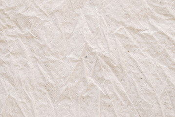 A sheet of a creased recycled tissue paper texture as background