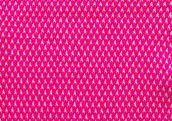 Pink spotted interlock pattern fabric as background
