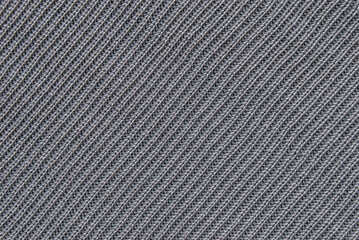 Soft gray ribbed knit fabric pattern close up as background