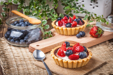 Fresh homemade fruit tart with strawberries and blueberries.