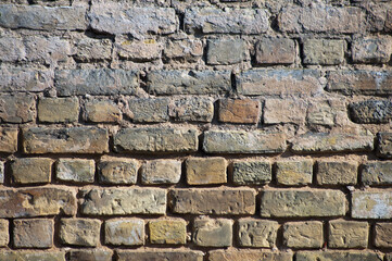 brown background, in the photo an old brick wall