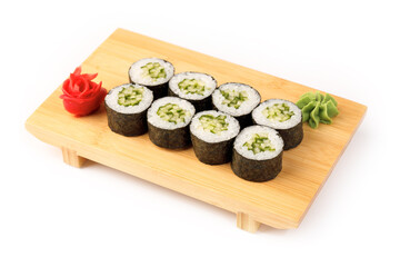 Delicious sushi rolls arranged on a wooden serving tray