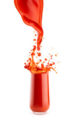 Bright red tomato juice stream of juice flowing into glass with flying drops, splashing, isolated. Energy vitamin vegetable cocktail for healthy fitness meny, diet, organic cuisine, antioxidant food.