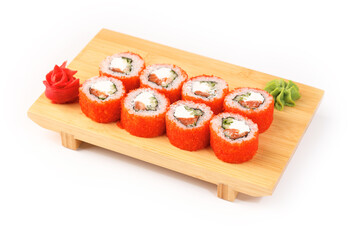 Sushi rolls on a wooden platter in a vibrant setting