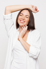 Tender slender smiling young woman with slim fit body perfect skin wear lingerie underwear cotton shirt touching face isolated on plain solid white background studio portrait. Lifestyle diet concept.