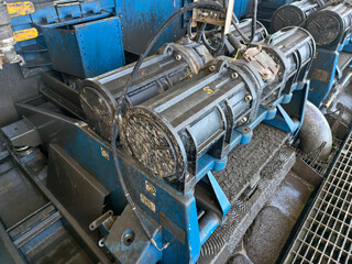 A shale shaker on an oil rig is a vibrating screen that separates large drilled solids, or cuttings, from the drilling fluid, or mud.