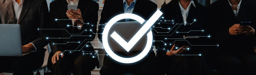 Business professionals working in a modern environment use electronic devices while showcasing a...