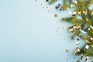 Christmas border with fir branches and golden decorations.