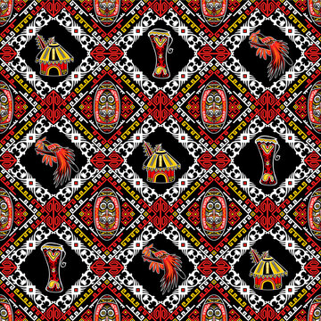 Dynamic seamless batik pattern inspired by Papuan nature and tribal symbols, featuring bird of paradise and bold diagonal ethnic ornaments.