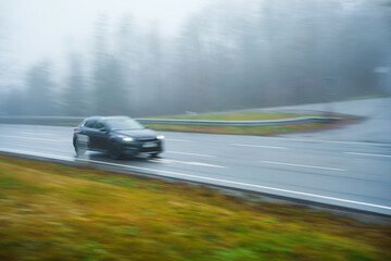 a car on the freeway in the heavy fog