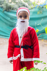 christmas celebration with adorable child dressed as santa