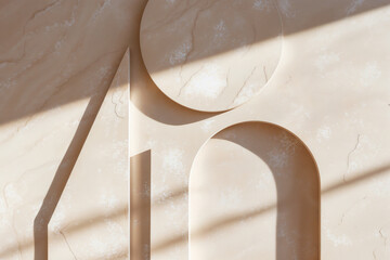 A minimalist abstract composition featuring carved geometric shapes resembling the number 40 on a textured beige stone surface, illuminated by sunlight casting diagonal shadows.