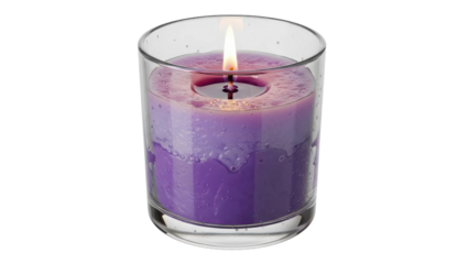 Burning purple candle in clear glass jar black background