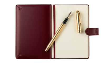 Isolated stationery set of bound journal with gold fountain pen and cap atop open pages