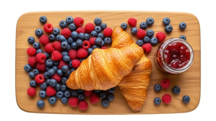 Isolated breakfast with croissants, fresh berries, and jam on a wooden serving board
