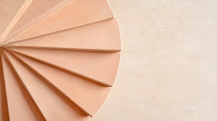 A textured, light peach-colored surface with a spiral pattern.