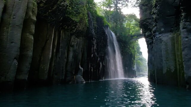 Takachiho Gorge in Takachiho, Miyazaki, Kyushu, Japan, Waterfall flowing between mossy cliffs in a forest river gorge