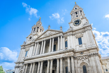 Front facade of St Paul&rsquo;s Cathedral on a sunny day with a blue sky in London