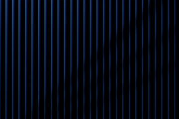 Obraz premium Abstract vertical lines pattern in deep blue tones with varying shades creating a modern artistic background design
