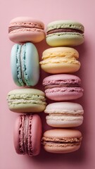 Fototapeta premium Colorful Assorted French Macarons on Pastel Pink Background – Vibrant Macaron Flat Lay Dessert
