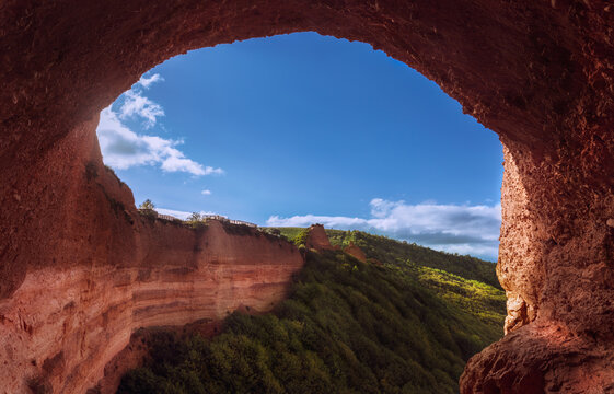 View through a natural arch of an ancient Roman gold mining landscape, Las Medulas, Leon, Spain