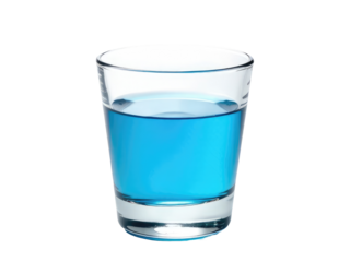 A clear glass filled with blue liquid sits on a clean white surface.transparent background