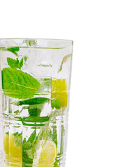 Refreshing mint and lime beverage served in a clear glass during summertime