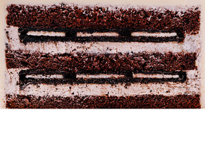 Chocolate layer cake with cream filling displayed on a white background