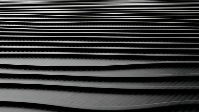 Horizontal wavy dark gray lines creating a textured abstract background with shadow play